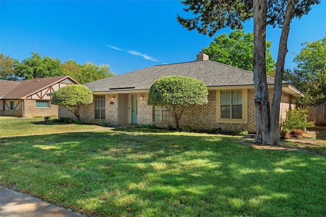 single story home with a front lawn