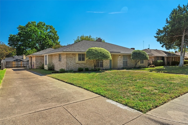 ranch-style home with a front yard