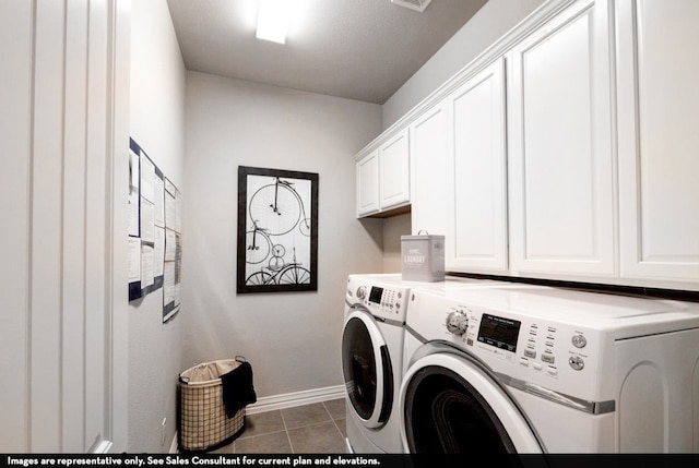 laundry area featuring independent washer and dryer, tile patterned flooring, and cabinets