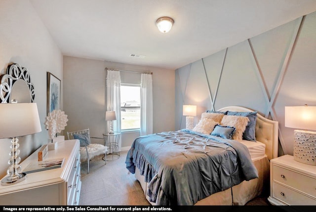 bedroom featuring light colored carpet