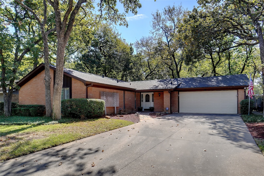 ranch-style home with a garage