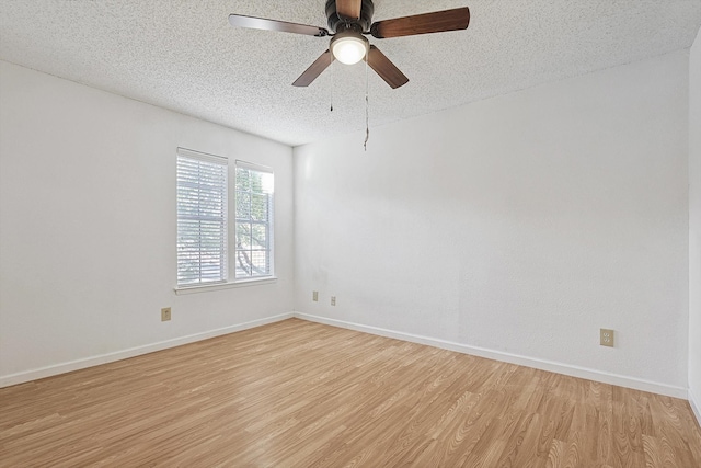 unfurnished room with ceiling fan, a textured ceiling, and light hardwood / wood-style flooring