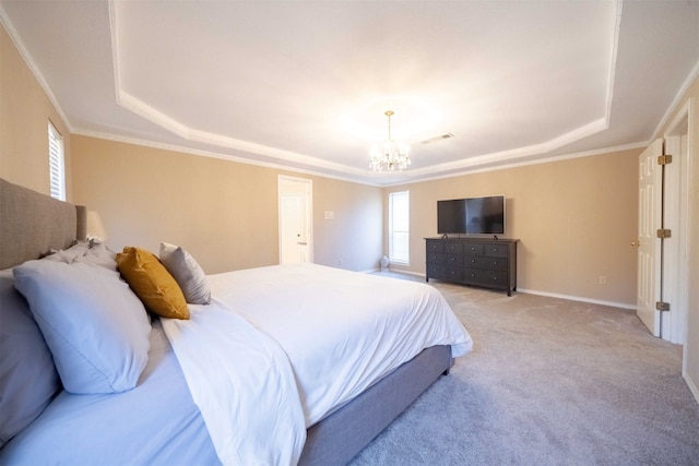 carpeted bedroom featuring crown molding, a tray ceiling, and an inviting chandelier