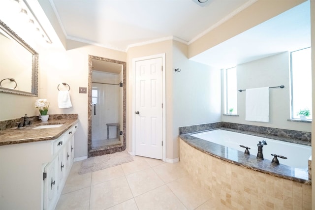 bathroom featuring vanity, crown molding, shower with separate bathtub, and tile patterned flooring