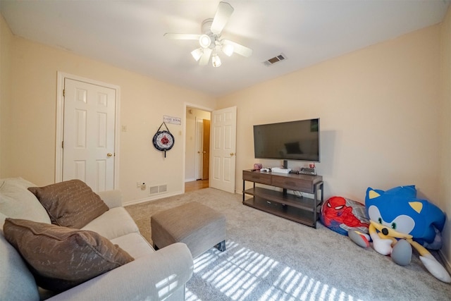 living room featuring ceiling fan and light carpet