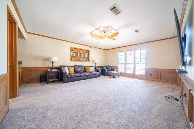 living room with light carpet and crown molding