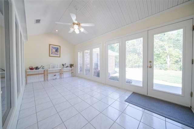 entryway with vaulted ceiling, ceiling fan, light tile patterned flooring, and plenty of natural light