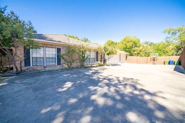 ranch-style home featuring a garage