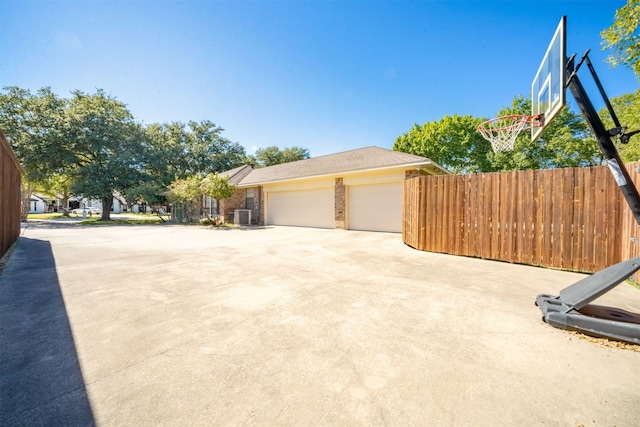 view of home's exterior featuring a garage and cooling unit