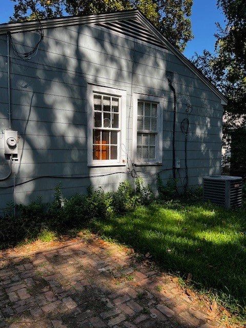 view of property exterior with cooling unit