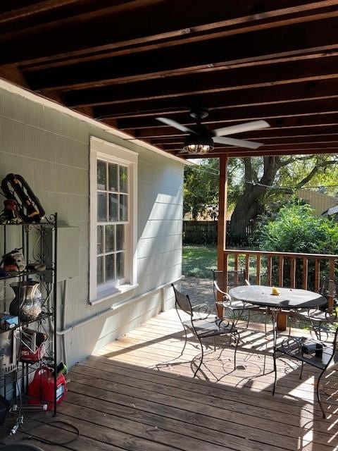 deck featuring ceiling fan and outdoor dining area