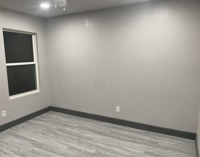 spare room featuring light hardwood / wood-style flooring