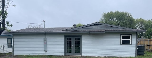 view of property exterior with french doors and central air condition unit