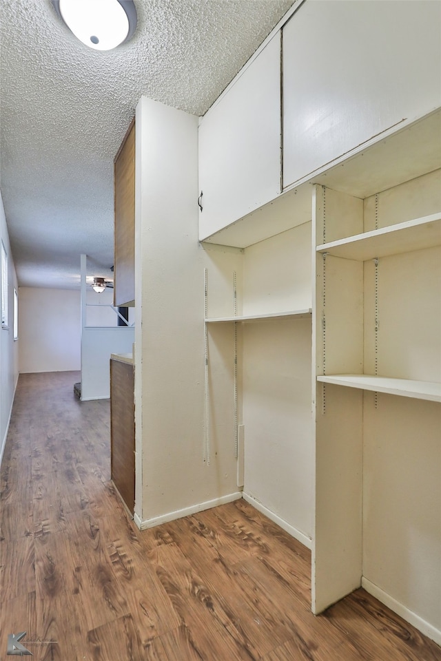 walk in closet featuring hardwood / wood-style floors