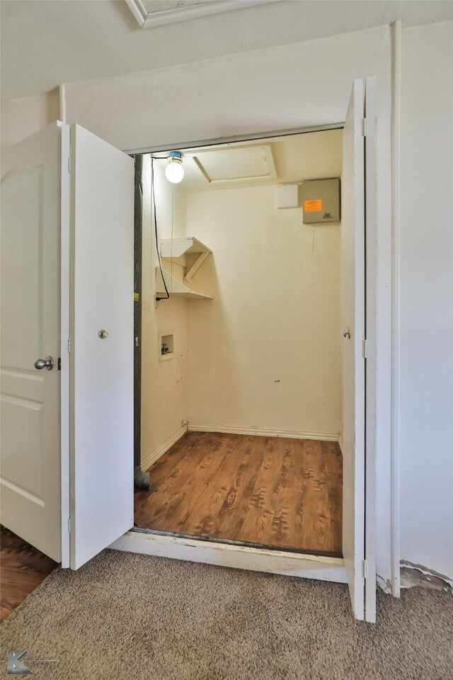 laundry area featuring washer hookup and dark hardwood / wood-style flooring