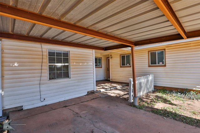 view of exterior entry featuring a patio