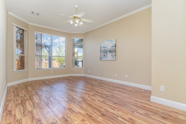 unfurnished room featuring light hardwood / wood-style floors, ceiling fan, and ornamental molding