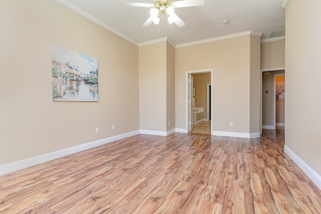 empty room featuring a textured ceiling, light hardwood / wood-style floors, ceiling fan, and ornamental molding