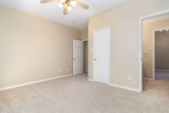 unfurnished bedroom with light carpet and ceiling fan