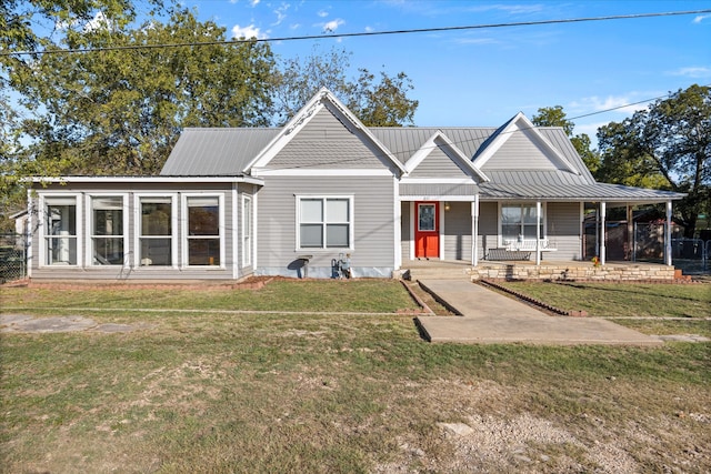 view of front of home featuring a front yard and a porch