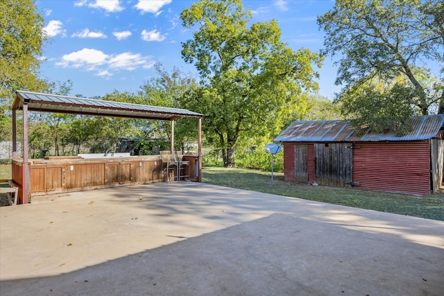 view of patio with an outdoor structure