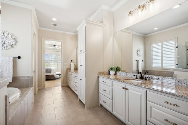 bathroom featuring tile patterned flooring, vanity, and crown molding