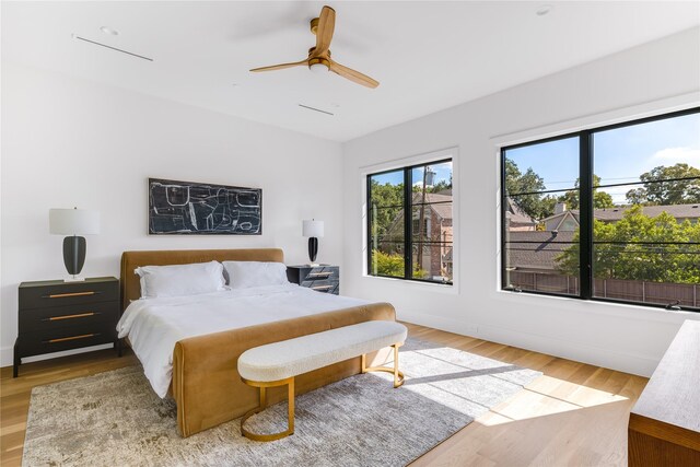 bedroom featuring ceiling fan and hardwood / wood-style floors