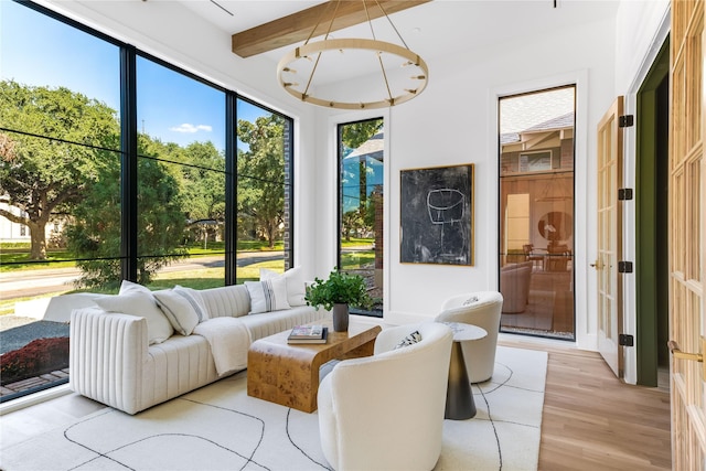 sunroom featuring beamed ceiling