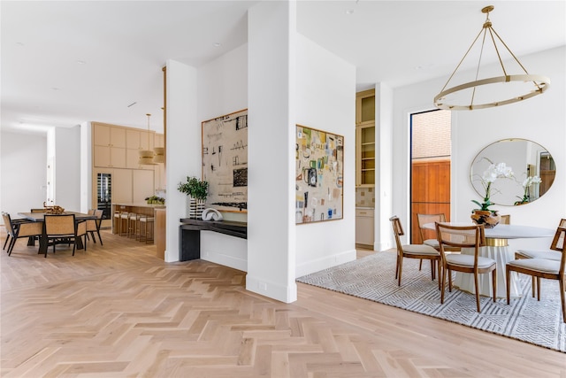 interior space featuring a towering ceiling and baseboards