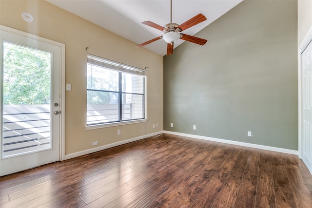 spare room with ceiling fan, dark hardwood / wood-style flooring, and lofted ceiling