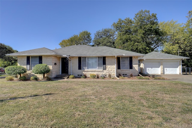 ranch-style home with a front lawn and a garage