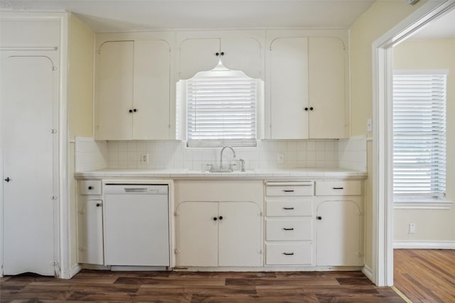 kitchen with tile countertops, dishwasher, white cabinets, and dark wood-type flooring