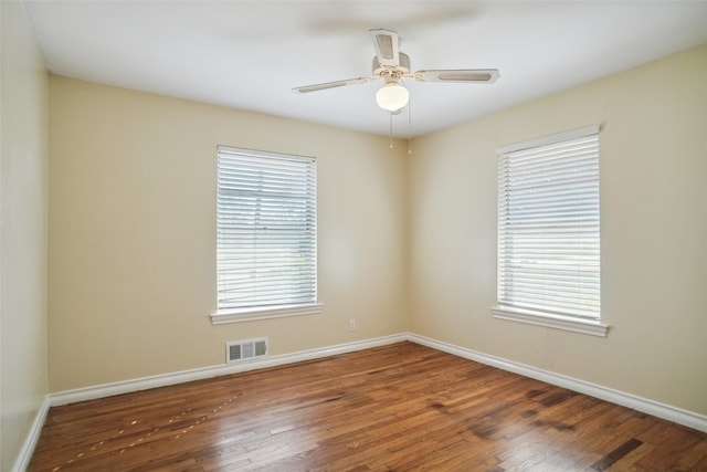 unfurnished room featuring ceiling fan and hardwood / wood-style floors