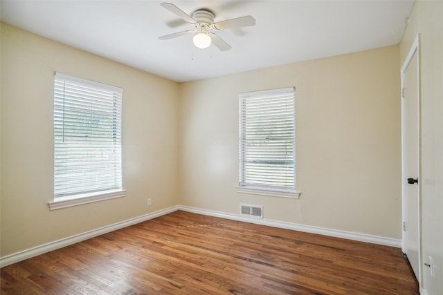 unfurnished room with hardwood / wood-style flooring and ceiling fan