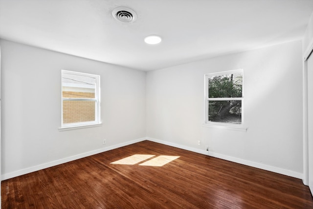 unfurnished room featuring hardwood / wood-style flooring