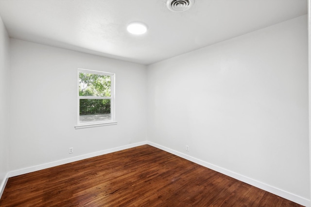 unfurnished room featuring hardwood / wood-style floors