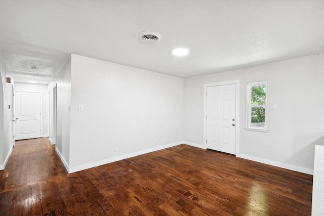 unfurnished room featuring dark hardwood / wood-style floors