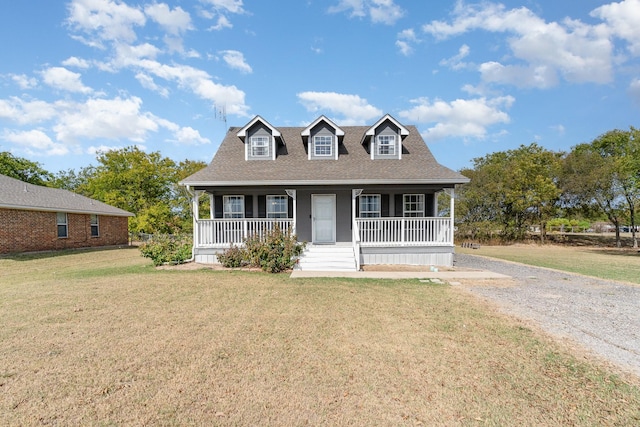 cape cod home featuring driveway, roof with shingles, a porch, and a front yard