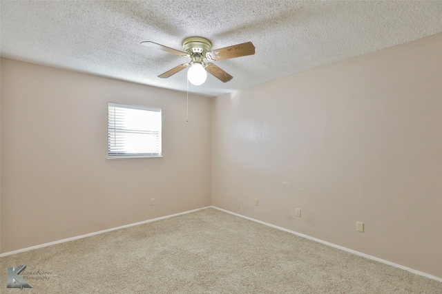 unfurnished room with carpet, a textured ceiling, and ceiling fan