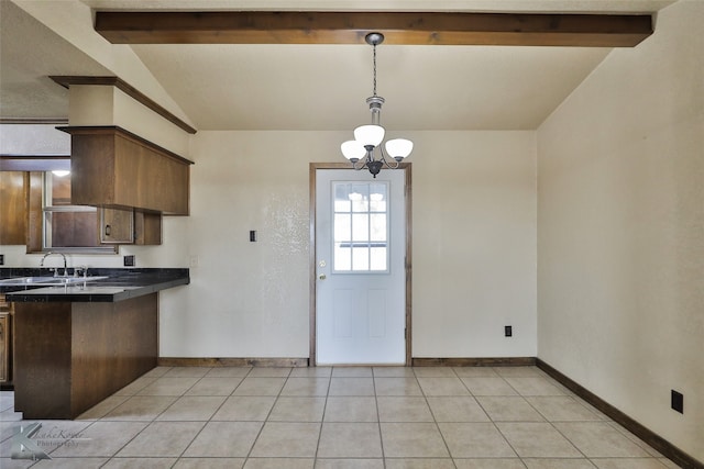 kitchen featuring vaulted ceiling with beams, hanging light fixtures, sink, light tile patterned flooring, and a chandelier