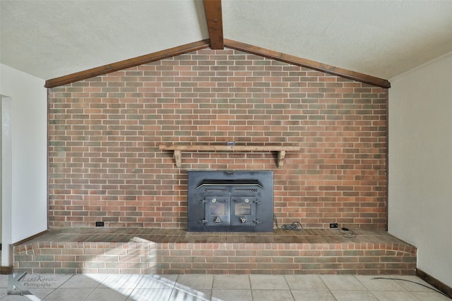 details featuring beamed ceiling, tile patterned floors, a textured ceiling, and a wood stove