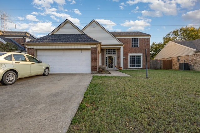 view of front of home with a front lawn and a garage