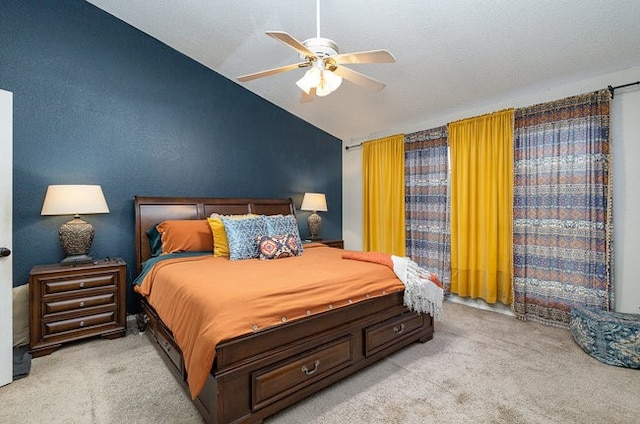 carpeted bedroom featuring lofted ceiling and ceiling fan