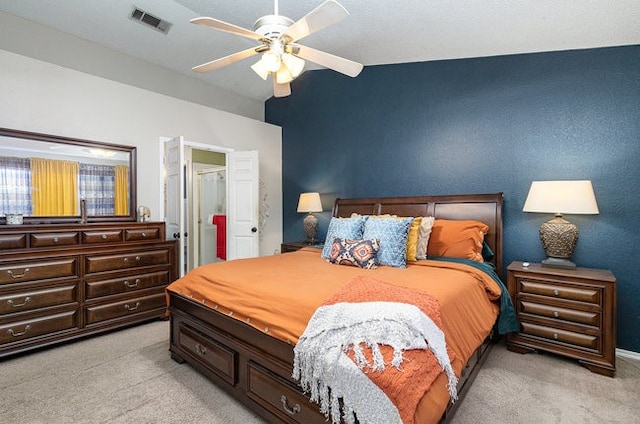 bedroom with light colored carpet and ceiling fan