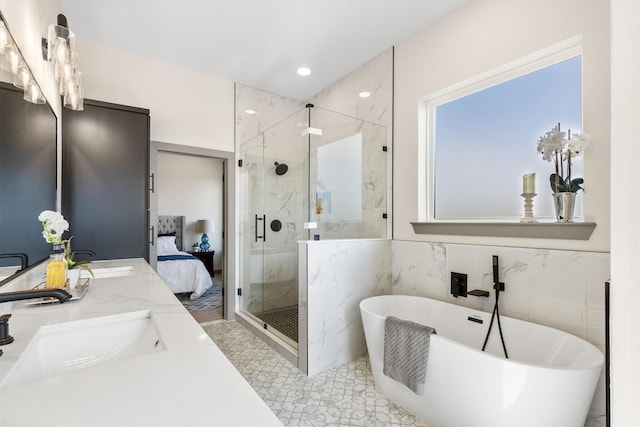 1561 Dixie Estates Way, Whitesboro, TX 76273 - full bath with a marble finish shower, a soaking tub, double vanity, ensuite bathroom, and tile walls