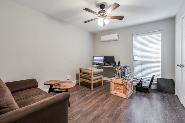 home office with dark wood-type flooring, ceiling fan, and an AC wall unit