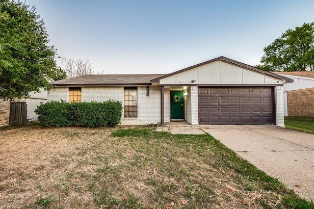 single story home featuring a front yard and a garage