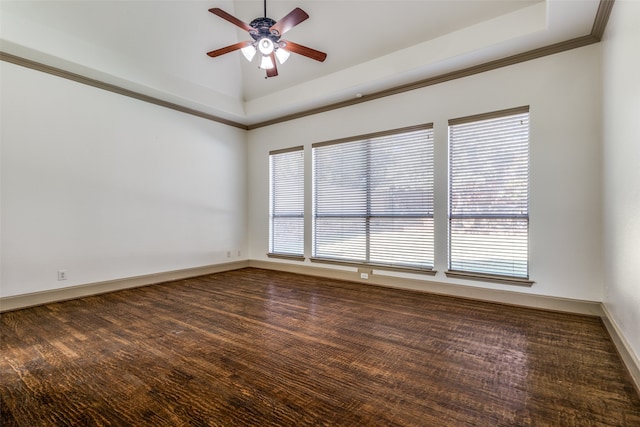 spare room with crown molding, dark hardwood / wood-style floors, a healthy amount of sunlight, and ceiling fan