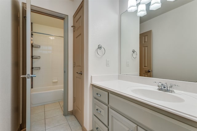 full bathroom featuring vanity, tiled shower / bath combo, tile patterned floors, and toilet