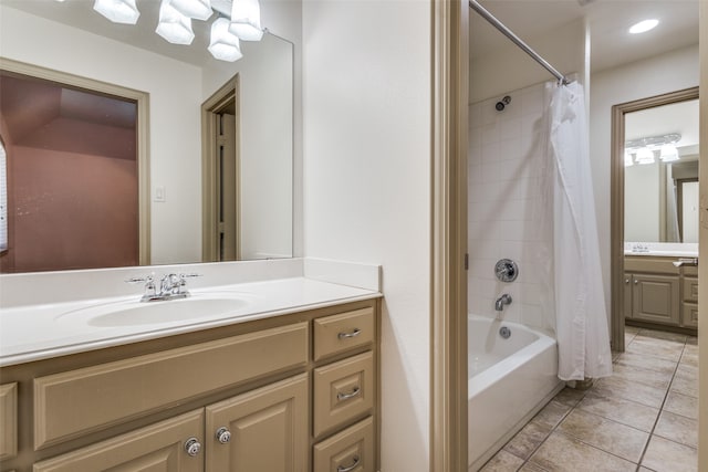 bathroom featuring vanity, tile patterned floors, and shower / tub combo